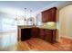 Well-equipped kitchen features dark countertops, wood cabinetry, and stainless steel dishwasher at 2608 Golden Bell Dr, Gastonia, NC 28056
