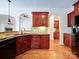 Well-equipped kitchen features dark countertops, wood cabinetry, and stainless steel dishwasher at 2608 Golden Bell Dr, Gastonia, NC 28056
