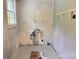 Basement space featuring a window, some utilities, and patterned tile flooring at 2791 Neill Rd, Lancaster, SC 29720
