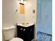 Modest bathroom with a toilet, sink, vanity, and overhead lighting fixture at 2791 Neill Rd, Lancaster, SC 29720