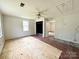 Sunny bedroom featuring a ceiling fan, closet, and floors ready for renovation to allow customization at 2791 Neill Rd, Lancaster, SC 29720