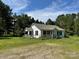 Charming one-story home featuring a welcoming covered porch and black shutters, surrounded by mature trees at 2791 Neill Rd, Lancaster, SC 29720