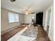 Spacious living room with a fireplace and large windows, ready for renovation with partially installed floors at 2791 Neill Rd, Lancaster, SC 29720