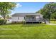 Back exterior features a covered patio and a large, fully fenced backyard at 2996 N Lookout St, Claremont, NC 28610