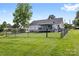 Spacious, fully fenced backyard with a large lawn, perfect for outdoor activities and pets at 2996 N Lookout St, Claremont, NC 28610