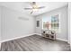 Light-filled bedroom with gray plank flooring and neutral decor at 2996 N Lookout St, Claremont, NC 28610