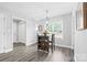A stylish dining room features a modern chandelier and seating for two at 2996 N Lookout St, Claremont, NC 28610