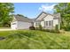 Well-manicured front yard and landscaping with a two-car garage and inviting facade at 2996 N Lookout St, Claremont, NC 28610
