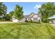 A well kept front yard of a single Gathering home with two car garage and well kept lawn at 2996 N Lookout St, Claremont, NC 28610