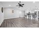 Open-concept living area features kitchen bar, modern decor, and spacious layout at 2996 N Lookout St, Claremont, NC 28610