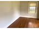 A bedroom with hardwood floors, a neutral color scheme, and natural light creating a cozy atmosphere at 327 Bonview Ave, Lincolnton, NC 28092