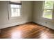 Bedroom featuring gleaming hardwood floors and lots of light from the two well-placed windows at 327 Bonview Ave, Lincolnton, NC 28092