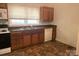 Functional kitchen featuring ample cabinetry, standard appliances, and a well-lit window at 327 Bonview Ave, Lincolnton, NC 28092