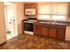An efficiently designed kitchen with wooden cabinets, standard appliances, and a stainless steel sink at 327 Bonview Ave, Lincolnton, NC 28092