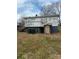 Exterior view of a property showing the weathered siding, a wooden deck, and the outdoor space at 341 Talley St, Troutman, NC 28166