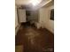 Dilapidated basement with damaged flooring and exposed pipes at 341 Talley St, Troutman, NC 28166