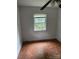 Bedroom with hardwood flooring and a window overlooking the yard at 341 Talley St, Troutman, NC 28166