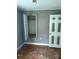 Bedroom with closet and weathered walls at 341 Talley St, Troutman, NC 28166