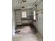 Unfinished kitchen featuring missing cabinetry and dated ceiling fan at 341 Talley St, Troutman, NC 28166
