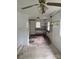 Unfinished kitchen featuring missing cabinetry and dated ceiling fan at 341 Talley St, Troutman, NC 28166