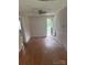 Living room features wood floors, ceiling fan and access to back yard at 341 Talley St, Troutman, NC 28166