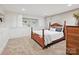 Bedroom featuring a wooden bed frame, built-in storage, and soft carpet at 3459 Selwyn Ave, Charlotte, NC 28209