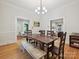 Elegant dining room with hardwood floors, natural light, and open access to living spaces at 3459 Selwyn Ave, Charlotte, NC 28209