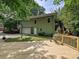 Exterior view of house featuring a deck, and basketball court at 3459 Selwyn Ave, Charlotte, NC 28209
