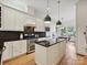 Beautiful kitchen with white cabinets, a large island, and stainless steel appliances at 3459 Selwyn Ave, Charlotte, NC 28209