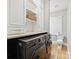 Convenient laundry room with modern washer and dryer, cabinets, and ample storage space at 3459 Selwyn Ave, Charlotte, NC 28209