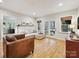 Inviting living room featuring a comfortable sectional sofa and natural light from french doors at 3459 Selwyn Ave, Charlotte, NC 28209
