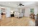 Bright bedroom featuring hardwood floors, a ceiling fan and ample natural light at 3459 Selwyn Ave, Charlotte, NC 28209