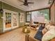 Serene screened porch with neutral colors, comfortable seating, and leafy surroundings at 3459 Selwyn Ave, Charlotte, NC 28209