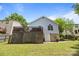 Exterior backyard view showcasing the raised wooden deck and a door to the basement at 3801 Rosedown Dr, Matthews, NC 28105