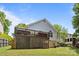 Backyard view featuring a raised wooden deck, perfect for outdoor relaxation and entertaining at 3801 Rosedown Dr, Matthews, NC 28105