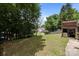 Spacious backyard with a raised wooden deck, offering ample room for outdoor activities at 3801 Rosedown Dr, Matthews, NC 28105