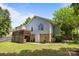 View of the house and backyard with an elevated deck and a basement door, perfect for outdoor entertaining at 3801 Rosedown Dr, Matthews, NC 28105