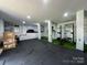 Finished basement with gym equipment, green space, and rubber flooring at 3801 Rosedown Dr, Matthews, NC 28105