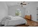 Bright bedroom features hardwood floors, a vaulted ceiling, and modern decor at 3801 Rosedown Dr, Matthews, NC 28105