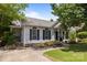 Charming one-story home with lush landscaping, brick accents, and inviting curb appeal at 3801 Rosedown Dr, Matthews, NC 28105