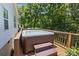Hot tub with easy access stairs, nestled on a wooden deck and ready for relaxation at 3801 Rosedown Dr, Matthews, NC 28105