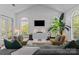 Bright living room with high ceilings, arched windows, and stylish modern furnishings at 3801 Rosedown Dr, Matthews, NC 28105