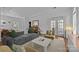 Spacious living room with modern furnishings, hardwood floors, and French doors at 3801 Rosedown Dr, Matthews, NC 28105