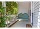 Inviting front porch with a comfortable swing, perfect for relaxing and enjoying the outdoors at 3801 Rosedown Dr, Matthews, NC 28105