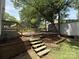 Paver patio with multiple levels and storage building in the backyard at 408 N Hill St, Dallas, NC 28034
