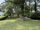 Lush, green backyard with a view of the home at 408 N Hill St, Dallas, NC 28034