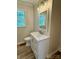 Bathroom featuring a white toilet and vanity with wood-look flooring and natural light at 408 N Hill St, Dallas, NC 28034