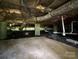 Spacious crawl space with concrete supports, plastic sheeting, and visible plumbing, providing easy access at 408 N Hill St, Dallas, NC 28034