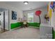 Playful bedroom with unique wall art, a desk by the window, and carpeted flooring at 4117 Bright Rd, Charlotte, NC 28214