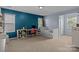 Well-lit bedroom with a daybed, and study area with carpeted floors at 4117 Bright Rd, Charlotte, NC 28214